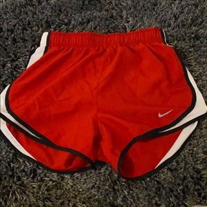 red nike shorts